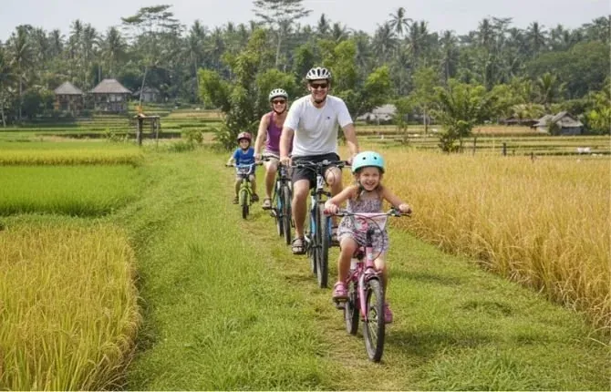 Family cycling tour through Bali rice fields